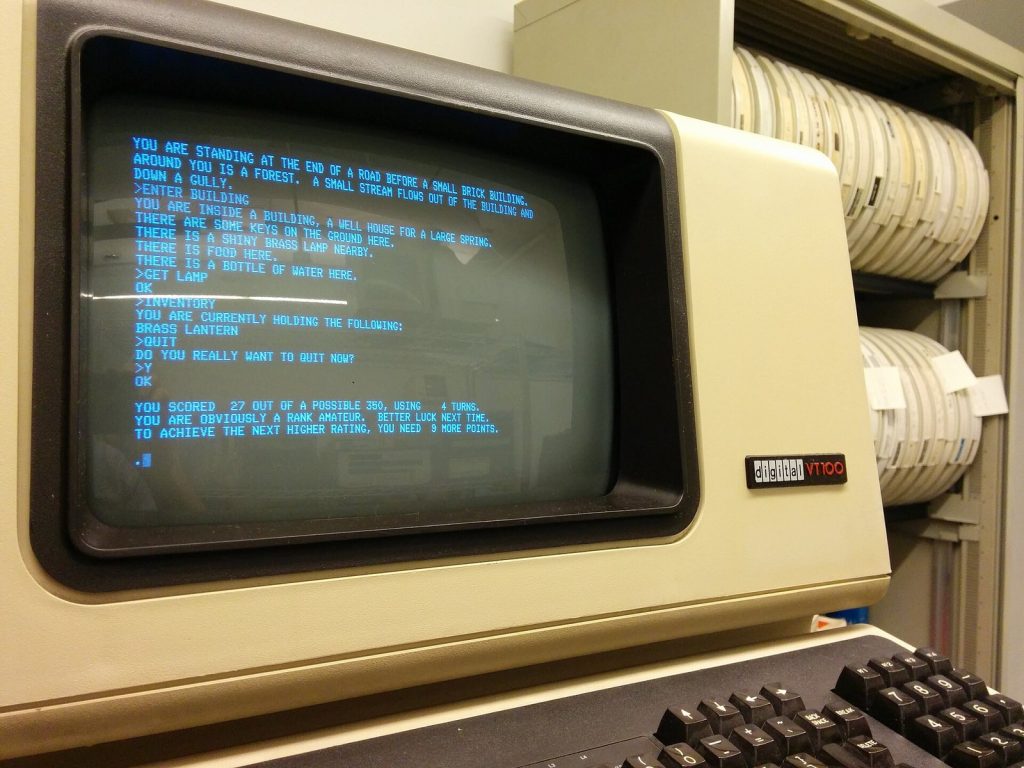 Colossal Cave Adventure text game running on a vintage VT100 computer terminal